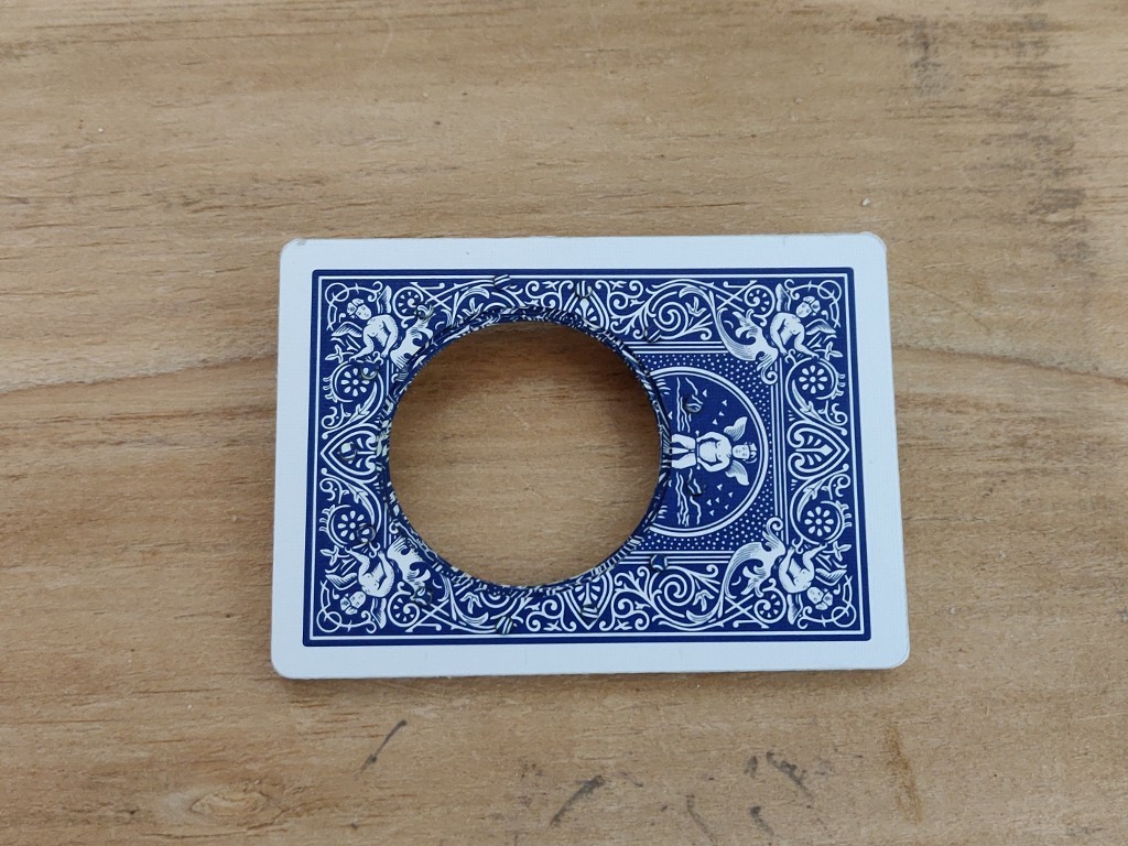 Playing card iris aperture open